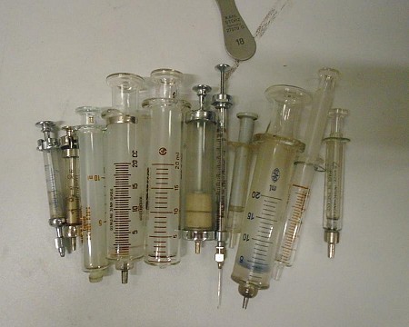 Period Glass and Metal Syringes